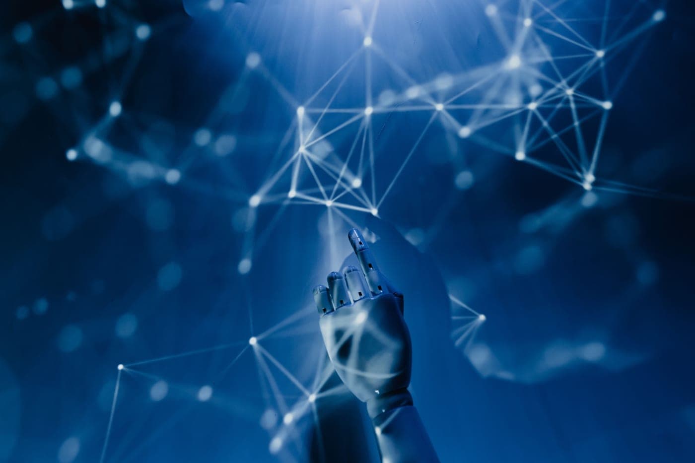 A robotic hand reaching toward a glowing network of connected data points.