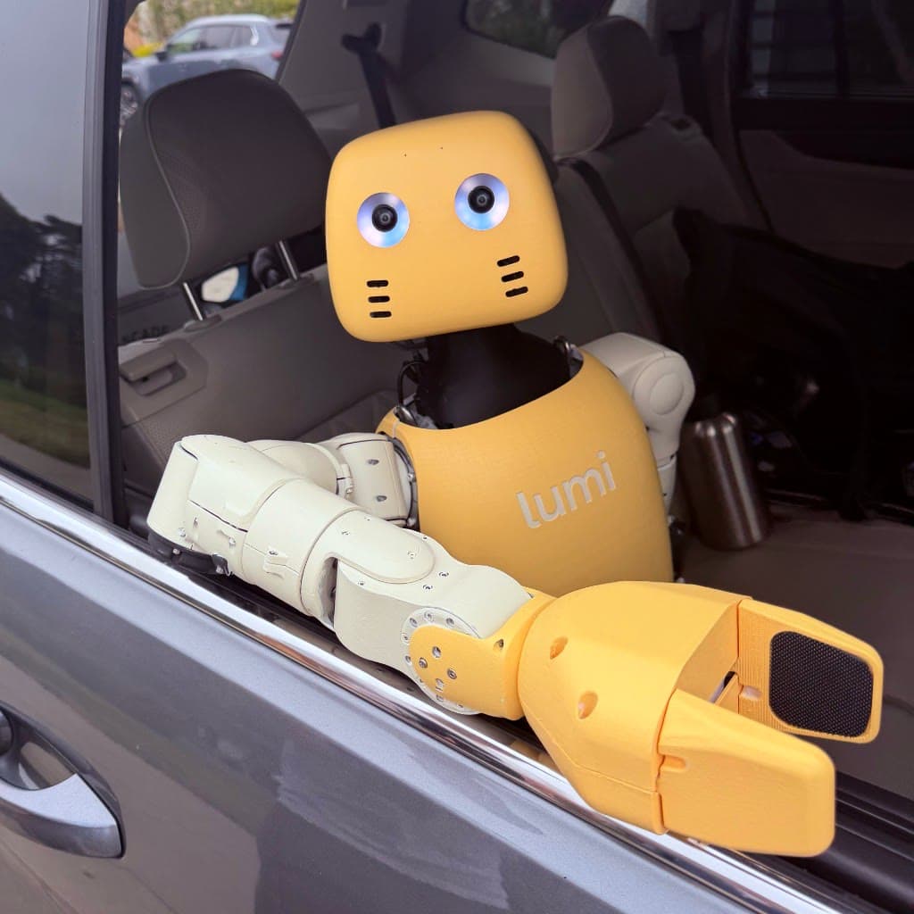 Lightberry's yellow-and-white Lumi humanoid robot leaning out of an open car window.